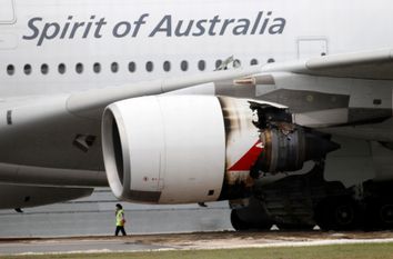 Qantas Airways A-380 passenger plane QF32 with its partially damaged engine sits on the tarmac after making an emergency landing at Changi airport in Singapore