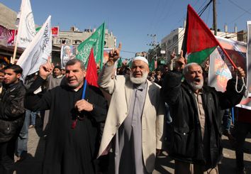 Hamas supporters attend a protest in Jabalya refugee camp in the northern Gaza Strip