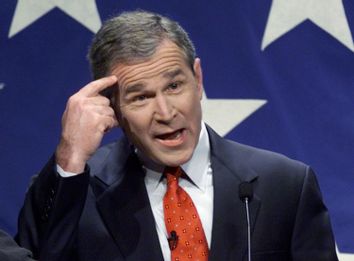 GEORGE W BUSH POINTS AT HIS HEAD BEFORE DEBATE.