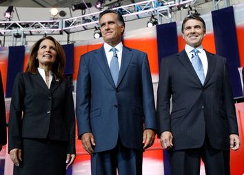 U.S. Republican presidential candidate, Rep. Michele Bachmann (R-MN), former Massachusetts Governor Mitt Romney (C) and Texas Governor Rick Perry
