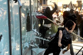 A small group of Occupy Oakland protesters smash windows