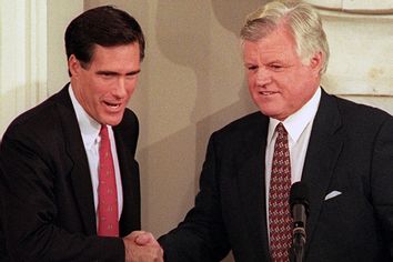 Democratic Senator Ted Kennedy (R) and his Republican challenger Mitt Romney shake hands at the start of their first debate of the campaign for the US Senate at Boston's Faneuil Hall on October 25, 1994.