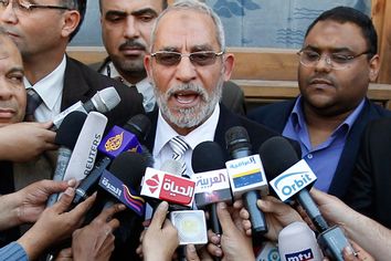 Muslim Brotherhood leader Mohammed Badie speaks to the media after