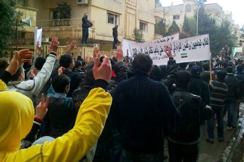 Demonstrators protest against Syria's President Bashar al-Assad in Homs