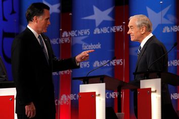 Republican presidential candidate former Massachusetts Governor Mitt Romney points at U.S. Rep. Ron Paul