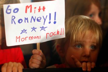 Three-year-old Dean Call holds a sign reading 