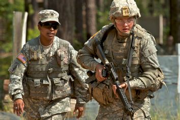 Esasha LeBlanc, left, an Army drill sergeant at Fort Jackson, S.C., works with Pvt. Daniel Ladd, 17, of Darlington, S.C.