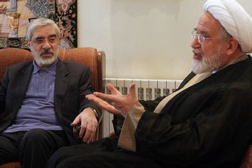 Leaders of Iranian opposition, Mahdi Karroubi, right, and Mir Hossein Mousavi talk in Tehran, Iran