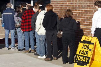 People waiting in line at a job fair in Portland, Ore.