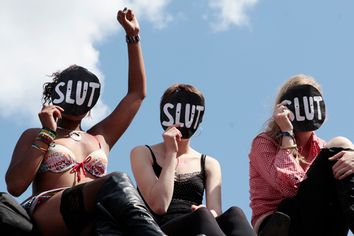 SlutWalk participants cheer a speaker