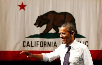 U.S. President Barack Obama waves before he speaks at a campaign event in Oakland