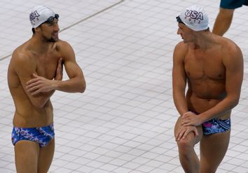 Michael Phelps and Ryan Lochte are seen during a training session of the U.S. swimming team at the main pool of the Aquatics Centre before the start of the London 2012 Olympic Games