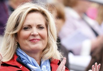 Ann Romney, wife of U.S. Republican presidential candidate Mitt Romney, applauds as her horse Rafalca ridden by Jan Ebeling competes in the equestrian dressage individual grand prix special at the London 2012 Olympic Games in Greenwich Park