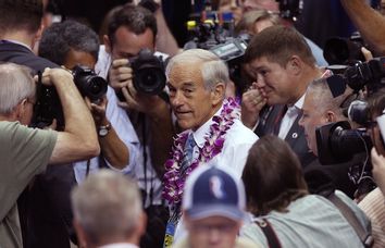 Former Republican presidential candidate Ron Paul greets convention goers as he walks the floor before the start of the second session of the 2012 Republican National Convention in Tampa