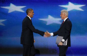 President Barack Obama joins former President Bill Clinton onstage after Clinton nominated Obama for re-election during the second session of the Democratic National Convention in Charlotte