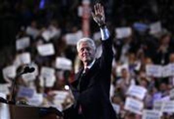 Former U.S. President Bill Clinton waves as he arrives to address the second session of the Democratic National Convention in Charlotte