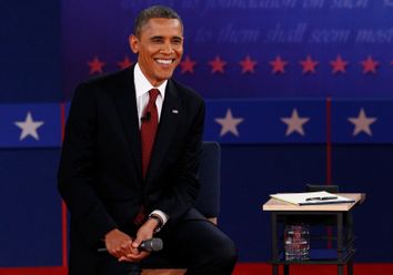 U.S. President Obama listens during the second presidential debate with Republican presidential nominee Romney in Hempstead