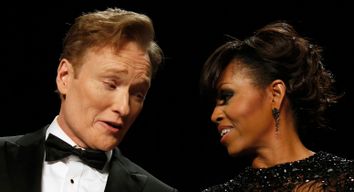 Comedian O'Brien talks to U.S. first lady Obama during the White House Correspondents Association Dinner in Washington