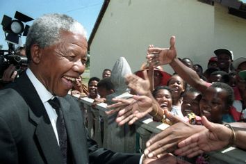 ANC LEADER MANDELA GREETS RESIDENTS OF MMABATHO.