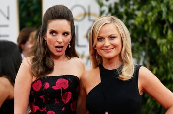 Tina Fey and Amy Poehler arrive at the 71st annual Golden Globe Awards in Beverly Hills