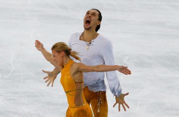 Russia's Tatiana Volosozhar and Maxim Trankov celebrate during the Figure Skating Pairs Free Skating Program at the Sochi 2014 Winter Olympics