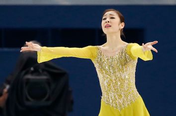 Korea's Yuna Kim finishes her program during the Figure Skating Women's Short Program at the Sochi 2014 Winter Olympics