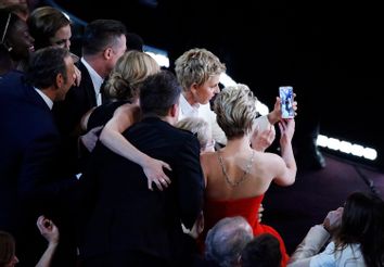 Host Degeneres takes a group picture at the 86th Academy Awards in Hollywood