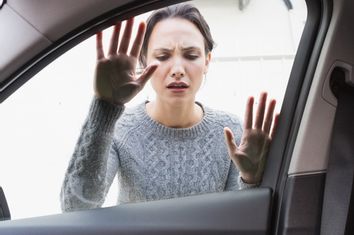 Woman Looking Into Car