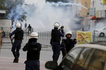 Riot police fires tear gas at protesters during clashes after a protest against the execution of prominent Shi'ite Muslim cleric Nimr al-Nimr by Saudi authorities in village of Sitra south of Manama