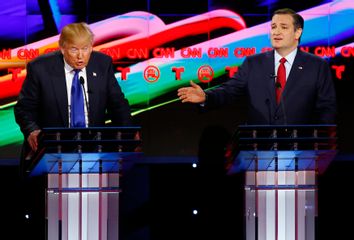 Republican U.S. presidential candidates Trump and Cruz speak simultaneously as they discuss an issue during the debate sponsored by CNN for the 2016 Republican U.S. presidential candidates in Houston