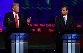 Republican U.S. presidential candidate Trump speaks as rival Cruz looks on at the Republican U.S. presidential candidates debate sponsored by CNN at the University of Miami in Miami