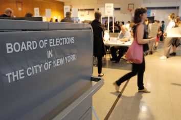 People vote in the New York primary elections at a polling station in the Brooklyn borough of New York