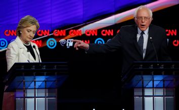 Democratic U.S. presidential candidate Sanders gestures towards rival Clinton as he speaks during a Democratic debate in New York