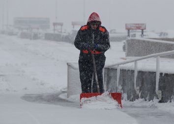 Denver International Airport maintenance man clears snow