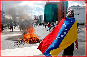 Protesters clash with riot police during a rally to demand a referendum to remove Venezuela's President Nicolas Maduro in Caracas