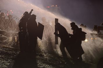 Police use a water cannon on protesters during a protest against plans to pass the Dakota Access pipeline near the Standing Rock Indian Reservation, near Cannon Ball, North Dakota, U.S.