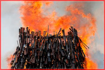 An assortment of 5250 illicit firearms and small weapons, recovered during various security operations burns during its destruction in Ngong hills near Kenya's capital Nairobi