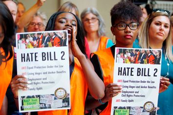 Members of the black community shout out their opposition to North Carolina's HB2 
