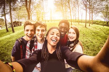 Selfie of young multiethnic friends in a park