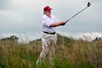 US tycoon Donald Trump plays a stroke as