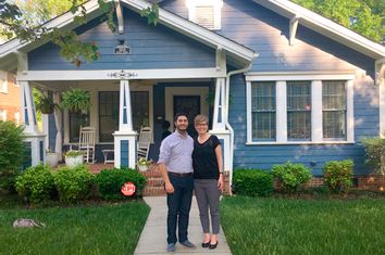The author and his wife Taylor in front of their home