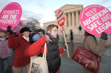 Pro-life and pro-choice supporters march