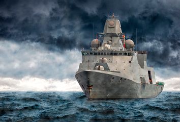 Military ship in a storm