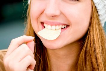 Teen eating chips