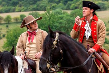 Josh Gad as LeFou and Luke Evans as Gaston in 