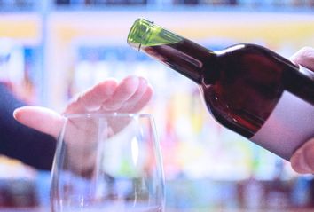 Woman Saying No to Drink