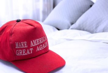 MAGA hat on bed