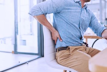 Man at desk in pain