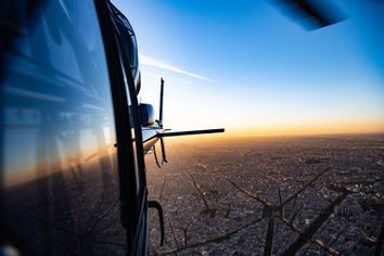 Helicopter flying over a city