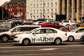 Uber driver driving a logo branded car